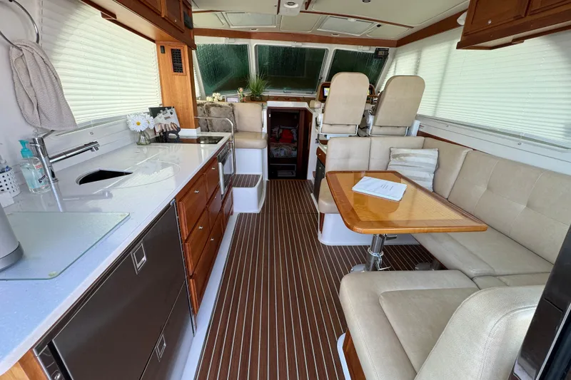 Slide: The Image of Interior of a 2021 Back Cove 41 yacht with modern kitchen and seating area. - 17