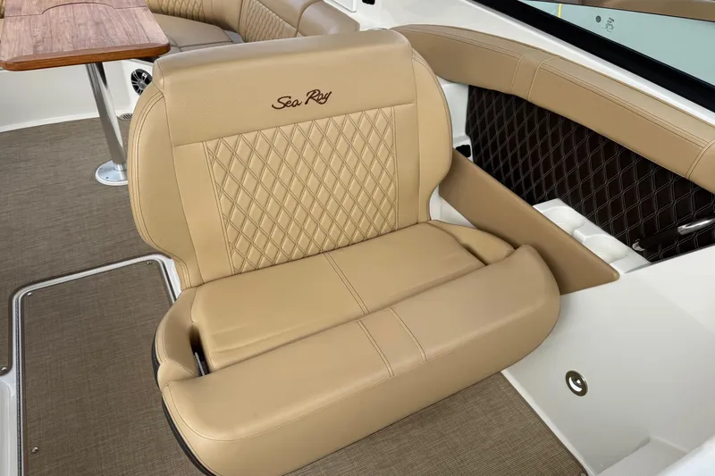 Slide: The Image of Luxurious tan seating on 2023 Sea Ray SLX 350 boat, featuring elegant diamond stitching. - 24