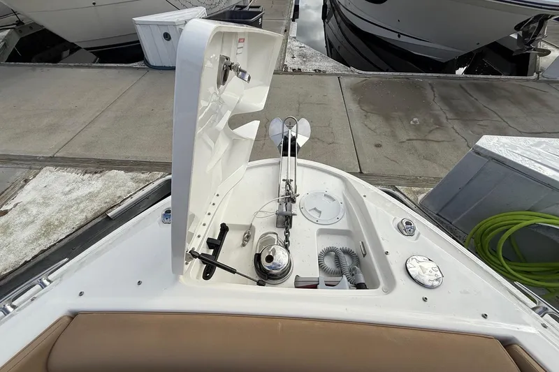 Slide: The Image of 2023 Sea Ray SLX 350 boat anchor compartment at dockside. - 36