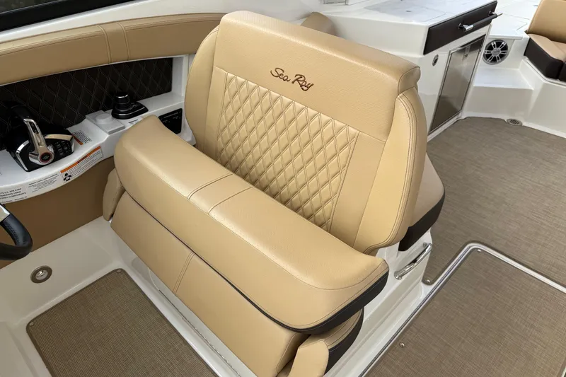 Slide: The Image of Luxurious tan seating in 2023 Sea Ray SLX 350 boat interior. - 26