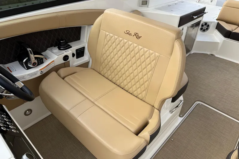 Slide: The Image of Luxurious tan seating in 2023 Sea Ray SLX 350 boat interior. - 27
