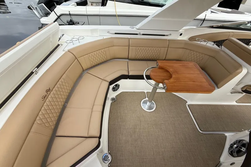 Slide: The Image of Luxurious seating area on 2023 Sea Ray SLX 350 boat with elegant tan upholstery. - 19