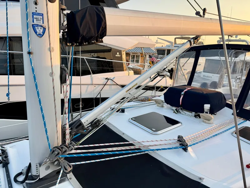 Slide: The Image of The image shows the deck of a 2009 Hunter 50 Center Cockpit sailboat with ropes and fittings. - 31