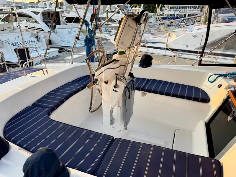 Slide: The Image of The image shows the cockpit of a 2009 Hunter 50 Center Cockpit with blue cushions. - 19