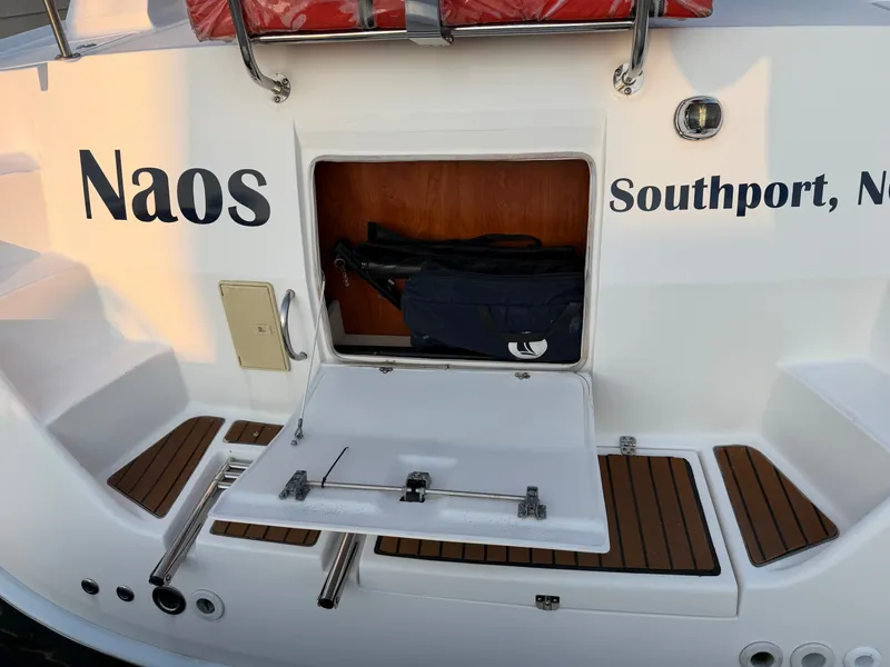 Slide: The Image of The stern of a 2009 Hunter 50 Center Cockpit with storage compartment and ladder. - 35