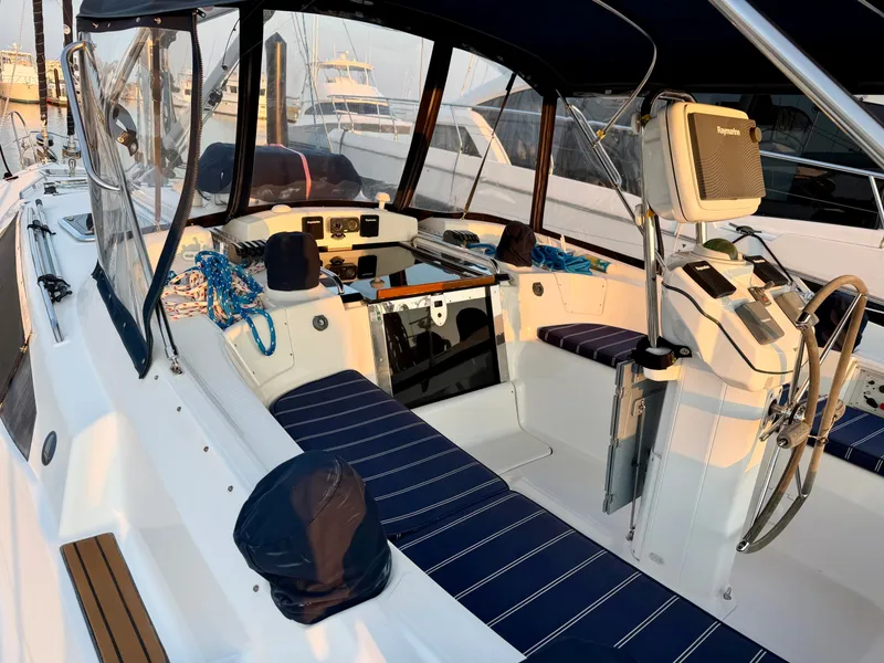 Slide: The Image of The image shows the cockpit of a 2009 Hunter 50 Center Cockpit yacht with blue cushions. - 21