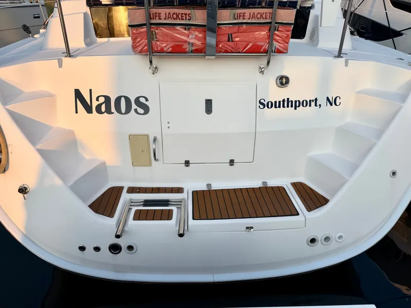 Slide: The Image of The stern of a 2009 Hunter 50 Center Cockpit with steps and life jackets. - 11