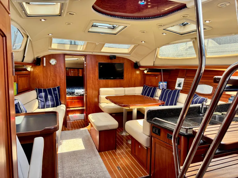 Slide: The Image of Interior of a 2009 Hunter 50 Center Cockpit yacht with elegant wood finishes. - 36