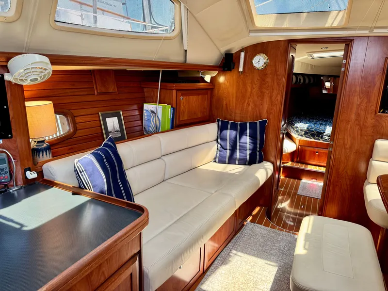 Slide: The Image of Interior of a 2009 Hunter 50 Center Cockpit with elegant wood finish and comfortable seating. - 43
