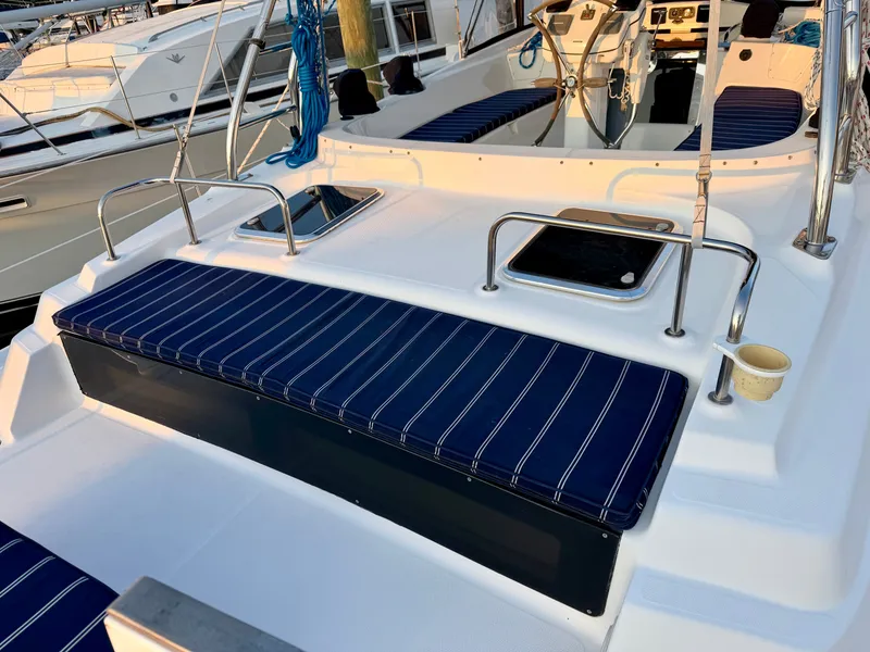 Slide: The Image of The image shows the cockpit of a 2009 Hunter 50 Center Cockpit with striped seat cushions. - 14