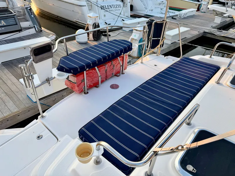 Slide: The Image of The image shows the cockpit of a 2009 Hunter 50 Center Cockpit with blue cushions. - 15