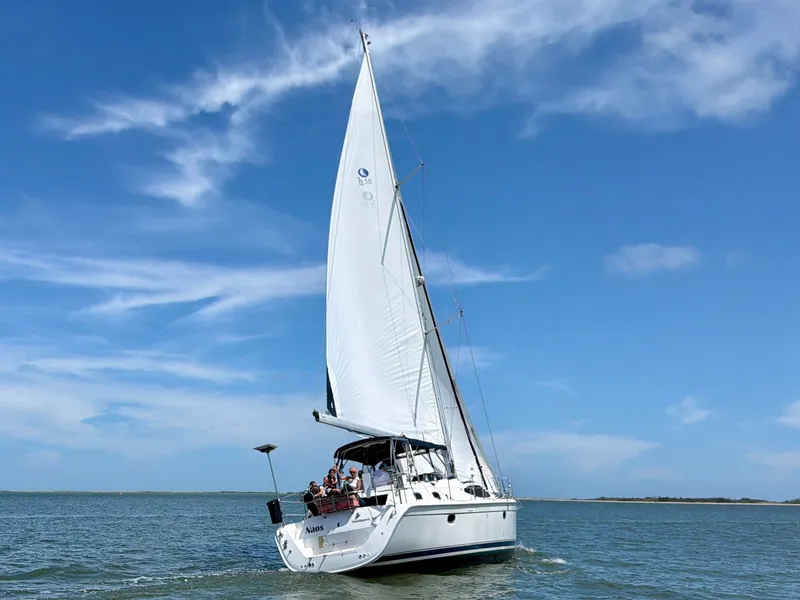 Slide: The Image of 2009 Hunter 50 Center Cockpit sailboat on the water. - 6