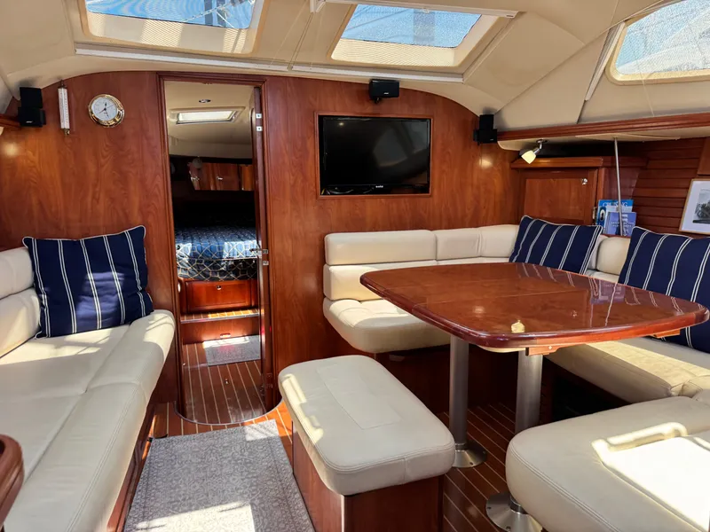 Slide: The Image of Interior of the 2009 Hunter 50 Center Cockpit with elegant wood furnishings and comfortable seating. - 37