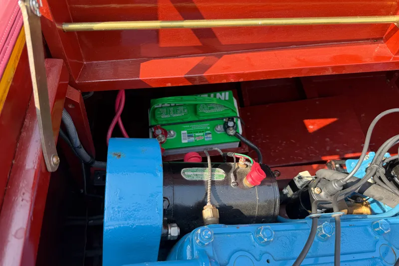 Slide: The Image of 1953 Chris Craft Riviera engine compartment with visible battery and components. - 20