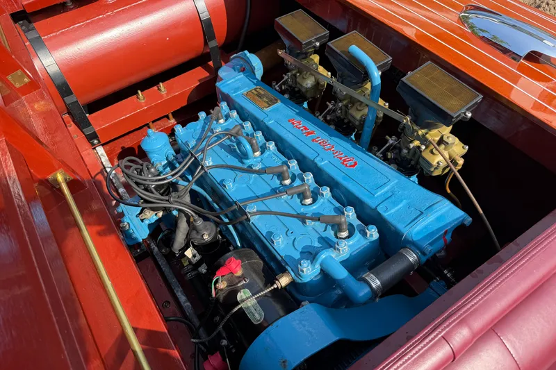 Slide: The Image of 1953 Chris Craft Riviera engine, vibrant blue, detailed view, classic boat restoration. - 19