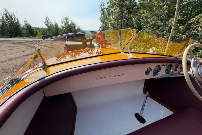 Slide: The Image of 1953 Chris Craft Riviera boat interior with classic dashboard and steering wheel. - 26