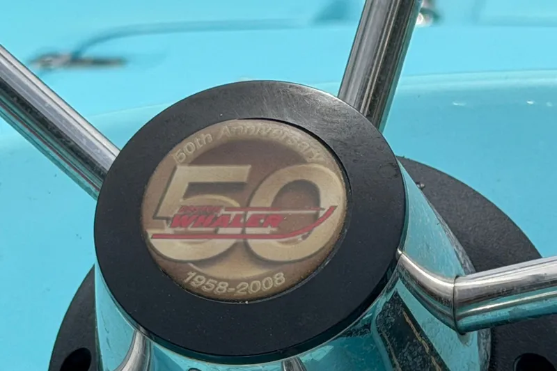 Slide: The Image of Steering wheel of 2009 Boston Whaler 130 Sport, 50th Anniversary emblem. - 15