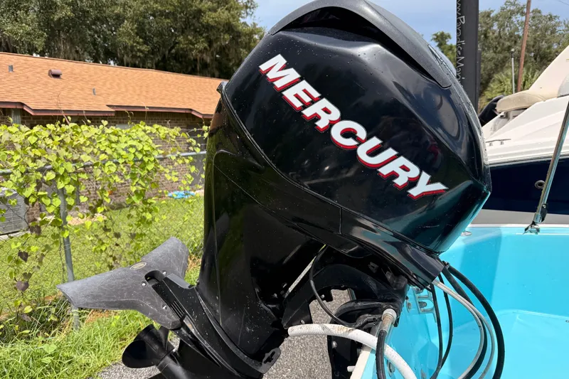 Slide: The Image of Mercury outboard motor on a 2009 Boston Whaler 130 Sport boat. - 20