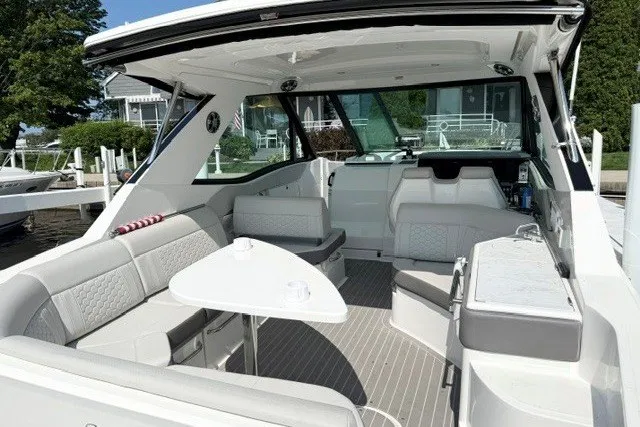 Slide: The Image of 2022 Sea Ray Sundancer 320 interior with modern seating and sleek design. - 6