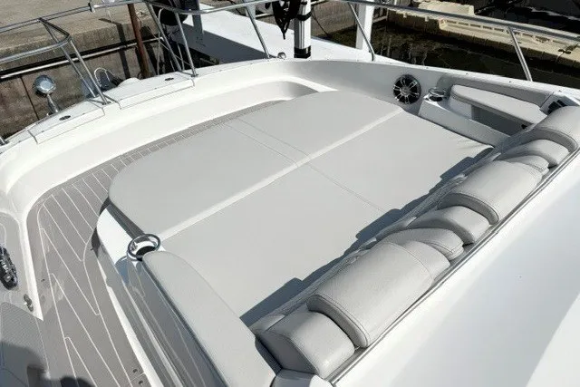 Slide: The Image of 2022 Sea Ray Sundancer 320 boat deck with cushioned seating and sleek design. - 22