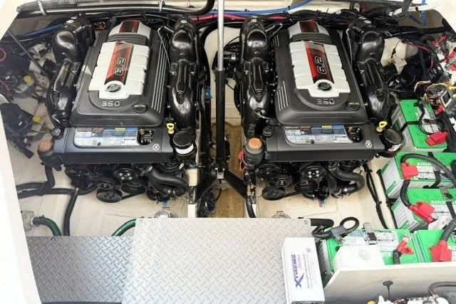 Slide: The Image of Twin engines in a 2022 Sea Ray Sundancer 320 boat engine compartment. - 19