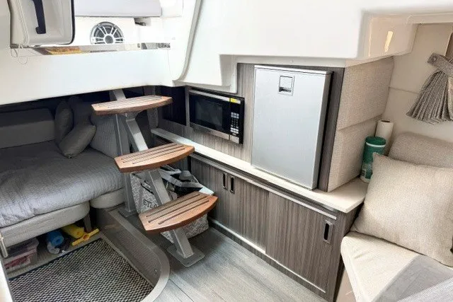 Slide: The Image of 2022 Sea Ray Sundancer 320 cabin interior with modern amenities and stylish design. - 28