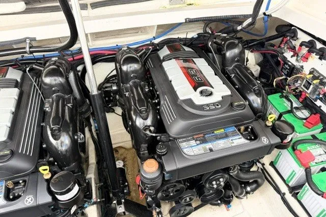 Slide: The Image of Engine compartment of a 2022 Sea Ray Sundancer 320 with twin 350 horsepower engines. - 15