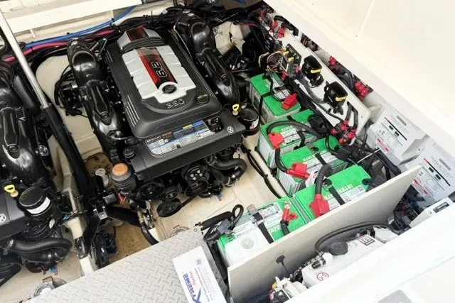 Slide: The Image of Engine compartment of 2022 Sea Ray Sundancer 320 with batteries and mechanical components. - 18