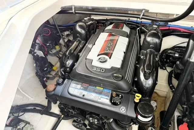 Slide: The Image of Engine compartment of a 2022 Sea Ray Sundancer 320 boat, featuring a 350 horsepower engine. - 16