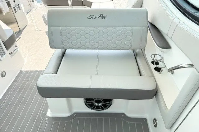 Slide: The Image of 2022 Sea Ray Sundancer 320 boat seat with cup holders and stylish upholstery. - 12