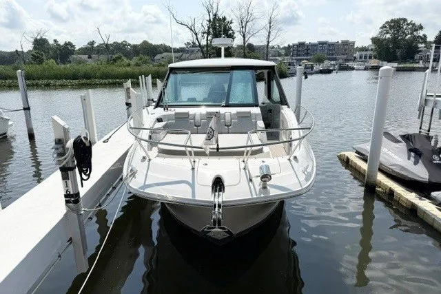 Slide: The Image of 2022 Sea Ray Sundancer 320 docked at a marina on a sunny day. - 4