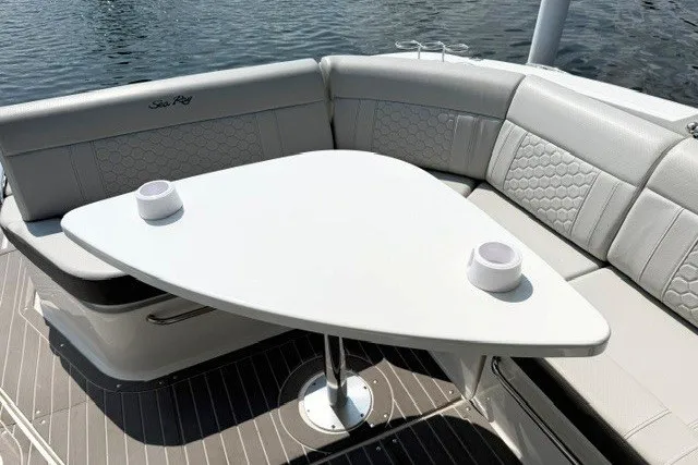 Slide: The Image of Luxurious seating area on 2022 Sea Ray Sundancer 320 yacht with modern table design. - 9
