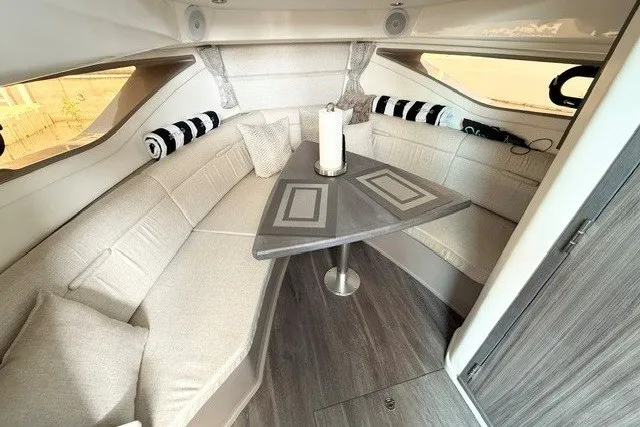 Slide: The Image of Interior of 2022 Sea Ray Sundancer 320, featuring elegant seating and modern design. - 31