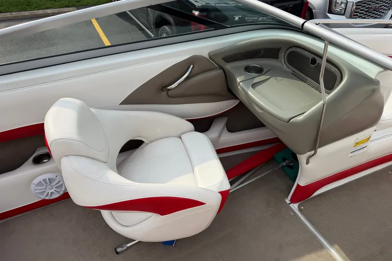 Slide: The Image of Interior of a 2011 Crownline 21 SS boat with white and red seating. - 13