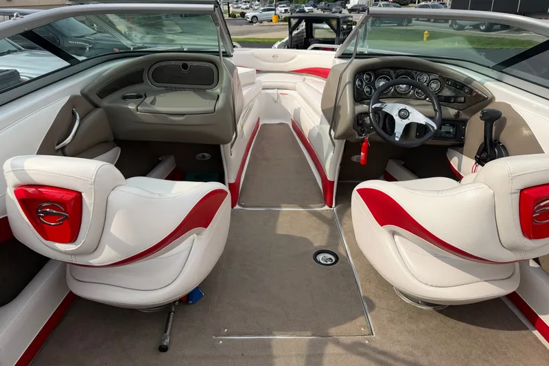 Slide: The Image of Interior of 2011 Crownline 21 SS boat with red and white seating and dashboard. - 3