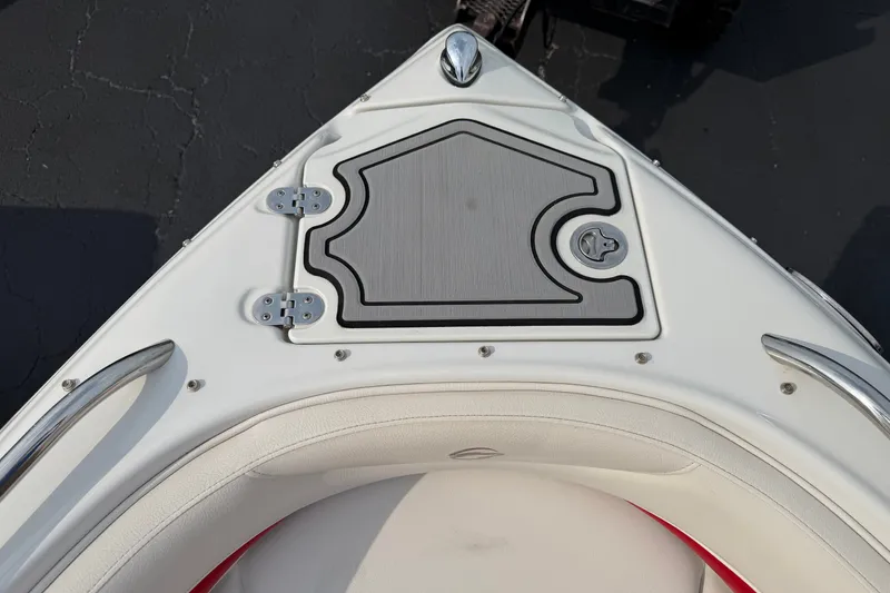 Slide: The Image of Bow of 2011 Crownline 21 SS boat with storage hatch and stainless steel fittings. - 6
