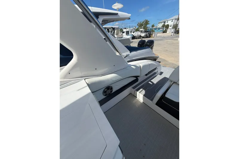 Slide: The Image of 2022 Regal 33 OBX boat interior with sleek seating and modern design. - 9