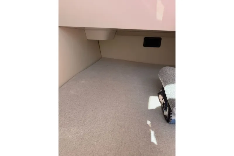 Slide: The Image of Interior cabin space of 2022 Regal 33 OBX boat, featuring carpeted flooring. - 27