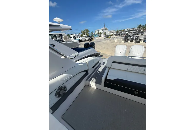 Slide: The Image of 2022 Regal 33 OBX boat interior with white seating and modern design. - 10
