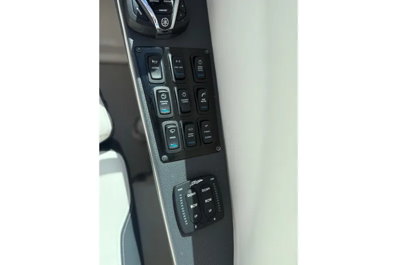 Slide: The Image of Control panel of 2022 Regal 33 OBX boat with various switches and buttons. - 20