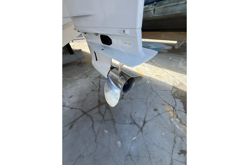 Slide: The Image of 2022 Regal 33 OBX boat propeller on cracked concrete surface. - 43