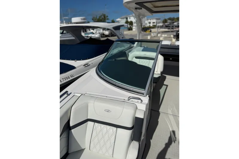 Slide: The Image of 2022 Regal 33 OBX boat interior with luxurious seating and sleek design. - 29