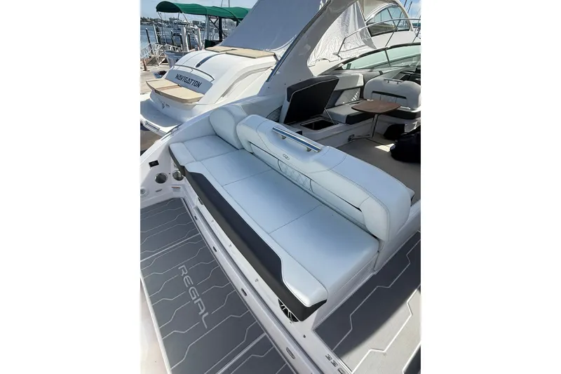 Slide: The Image of 2022 Regal 33 OBX boat interior with white seating and sleek design. - 5
