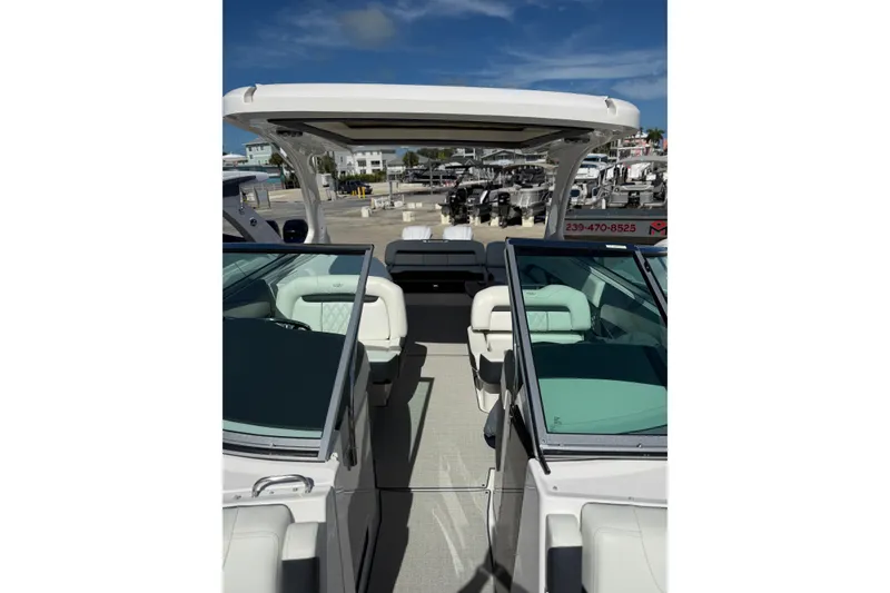 Slide: The Image of 2022 Regal 33 OBX boat interior with white seating and open deck. - 28