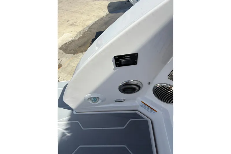 Slide: The Image of 2022 Regal 33 OBX boat interior with speakers and control panel. - 35
