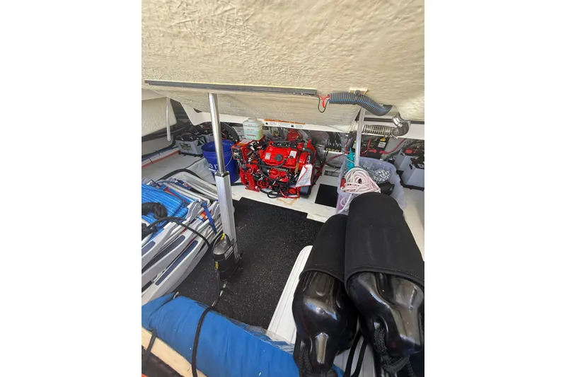 Slide: The Image of 2022 Regal 33 OBX boat interior showing engine compartment and equipment storage. - 37