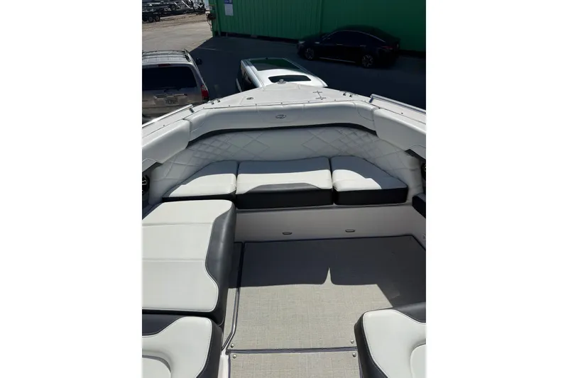 Slide: The Image of 2022 Regal 33 OBX boat interior with white cushioned seating and spacious layout. - 32
