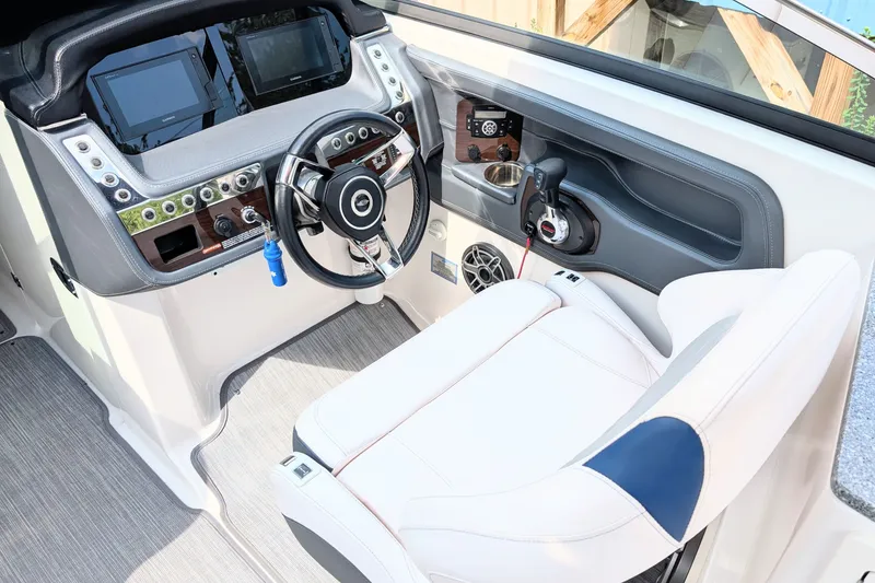 Slide: The Image of 2020 Chaparral 297 SSX boat cockpit with modern controls and comfortable seating. - 3