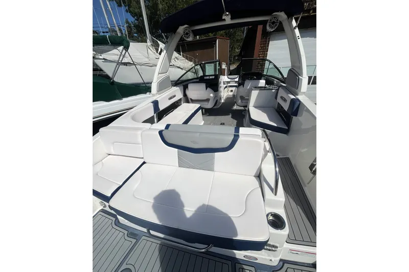 Slide: The Image of 2020 Chaparral 297 SSX boat interior with white seating and modern design. - 10