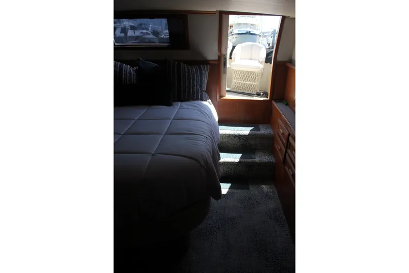 Slide: The Image of Interior of 1989 Californian 55 Cockpit Motor Yacht with bed and steps to deck. - 30